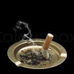 1623692-cigarette-and-ashtray-isolated-on-black-background